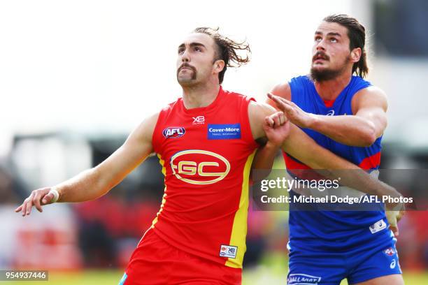 Brayden Crossley of the Suns and Tom Boyd of the Bulldogs compete for the ball during the round seven AFL match between the Western Bulldogs and the...