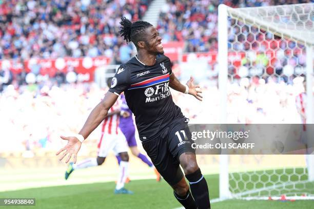 Crystal Palace's Ivorian striker Wilfried Zaha celebrates after scoring the equalising goal during the English Premier League football match between...