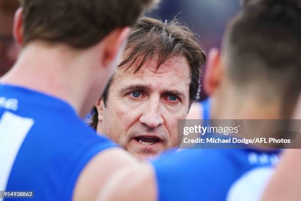 Bulldogs head coach Luke Beveridge speaks to his players during the round seven AFL match between the Western Bulldogs and the Gold Coast Suns at...