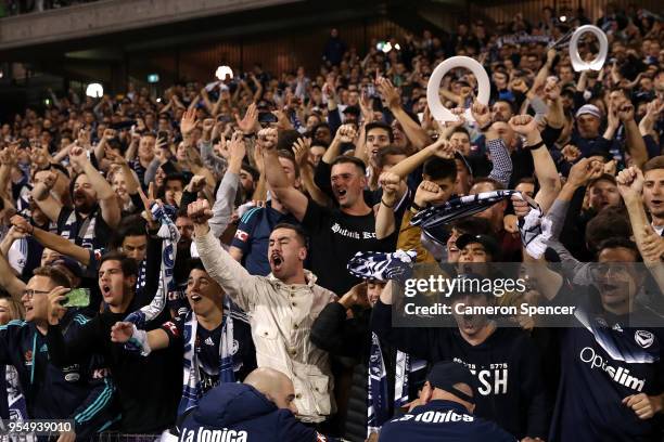 Victory fans celebrate winning the 2018 A-League Grand Final match between the Newcastle Jets and the Melbourne Victory at McDonald Jones Stadium on...