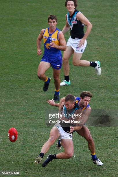 Mark Hutchings of the Eagles tackles Dan Houston during the round seven AFL match between the West Coast Eagles and the Port Adelaide Power at Optus...