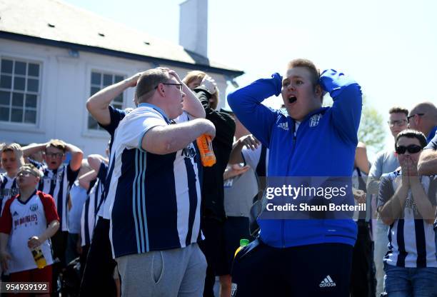 West Bromwich Albion fans watch the Stoke City and Crystal Palace game prior to the Premier League match between West Bromwich Albion and Tottenham...