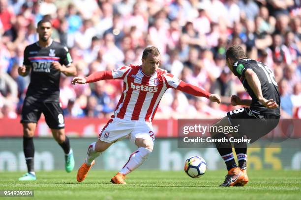 Xherdan Shaqiri of Stoke City battles for possession with James McArthur of Crystal Palace during the Premier League match between Stoke City and...