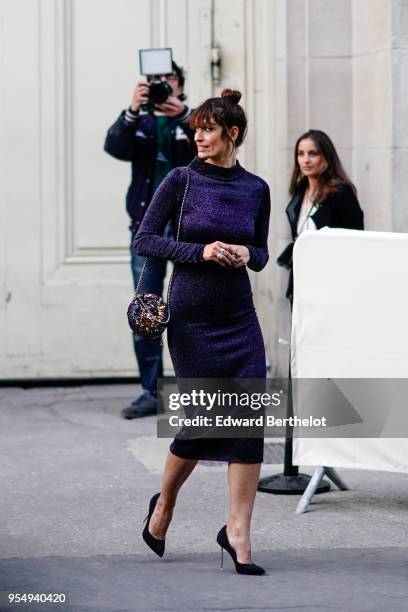 Caroline de Maigret wears a blue dress, outside the Chanel Cruise 2018/2019 Collection, at Le Grand Palais on May 03, 2018 in Paris, France.