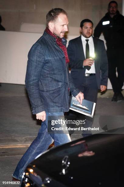 Ralph Fiennes is seen, outside the Chanel Cruise 2018/2019 Collection, at Le Grand Palais on May 03, 2018 in Paris, France.