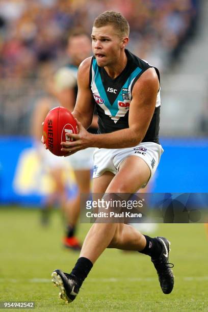 Dan Houston looks to handball during the round seven AFL match between the West Coast Eagles and the Port Adelaide Power at Optus Stadium on May 5,...
