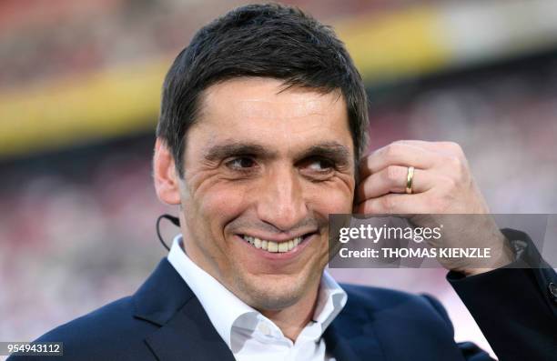 Stuttgart's Turkish head coach Tayfun Korkut smiles prior to the German first division Bundesliga football match VfB Stuttgart vs TSG 1899 Hoffenheim...