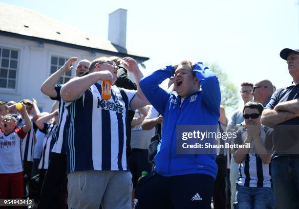 West Bromwich Albion fans watch the Stoke City and Crystal Palace game prior to the Premier League match between West Bromwich Albion and Tottenham...