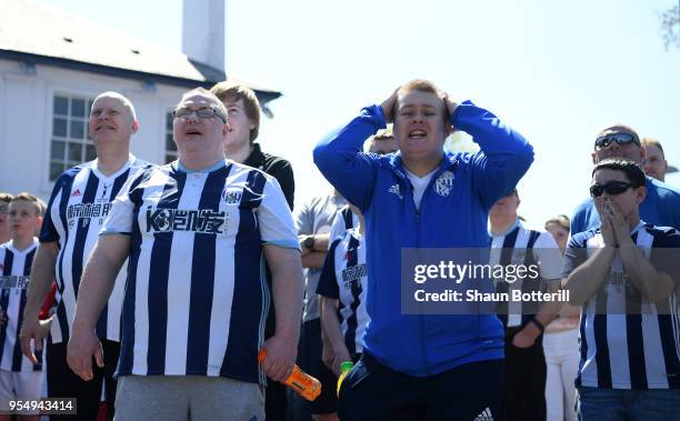 West Bromwich Albion fans watch the Stoke City and Crystal Palace game prior to the Premier League match between West Bromwich Albion and Tottenham...