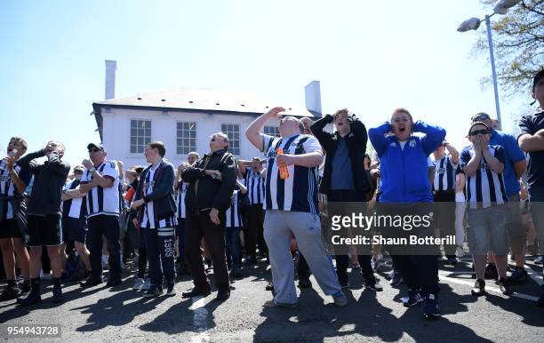 West Bromwich Albion fans watch the Stoke City and Crystal Palace game prior to the Premier League match between West Bromwich Albion and Tottenham...