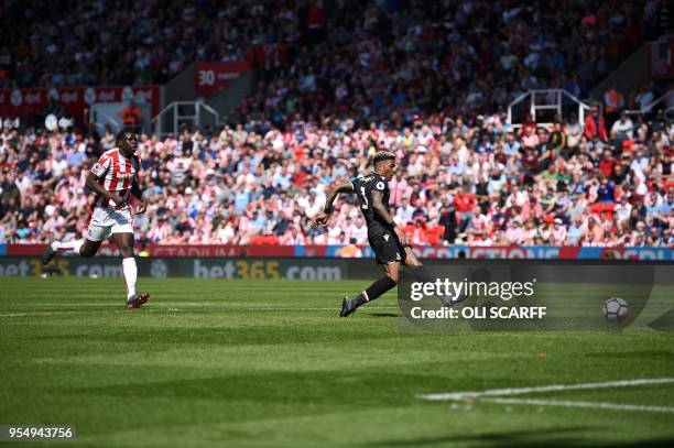 Crystal Palace's Dutch defender Patrick van Aanholt scores his team's second goal during the English Premier League football match between Stoke City...