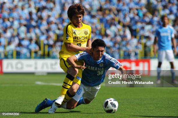 Yusuke Segawa of Kashiwa Reysol and Rikiya Uehara of Jubilo Iwata compete for the ball during the J.League J1 match between Kashiwa Reysol and Jubilo...