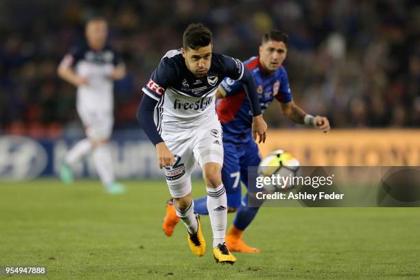 Stefan Nigro of the Victory is contested by Dimitri Petratos of the Jets during the 2018 A-League Grand Final match between the Newcastle Jets and...