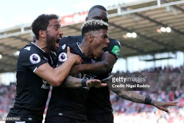 Patrick van Aanholt of Crystal Palcace celebrates scoring his side's second goal with team mates Andros Townsend and Christian Benteke during the...