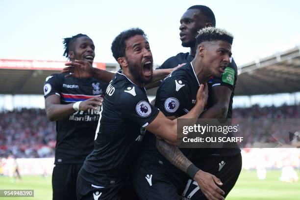 Crystal Palace's Dutch defender Patrick van Aanholt celebrates scoring his team's second goal with Crystal Palace's Ivorian striker Wilfried Zaha...