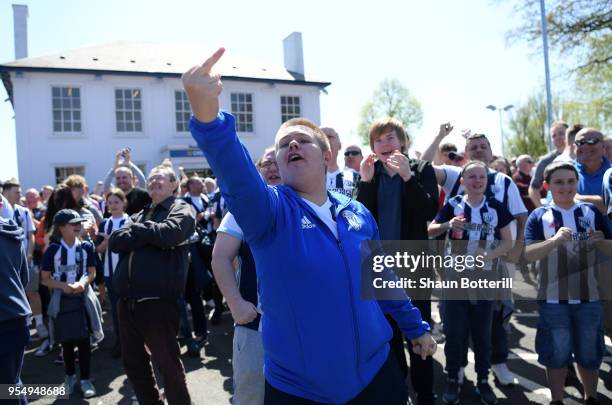 West Bromwich Albion fans react as they watch the Stoke City and Crystal Palace game prior to the Premier League match between West Bromwich Albion...