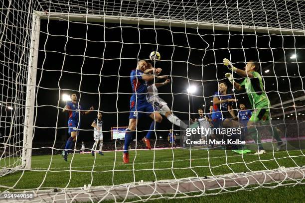 Besart Berisha of Melbourne Victory and Roy O'Donovan of the Jets compete for the ball in front of goal during the 2018 A-League Grand Final match...