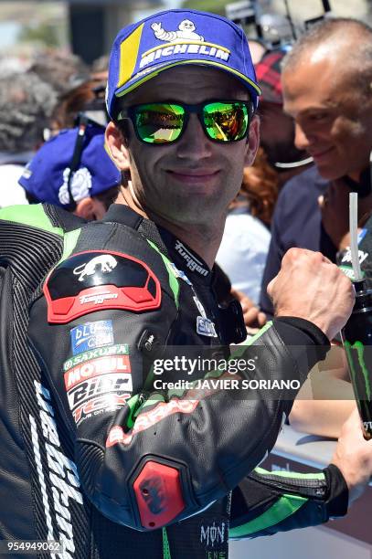 Monster Yamaha Tech 3's French rider Johann Zarco celebrates being third placed during the MotoGP qualifying session of the Spanish Grand Prix at the...