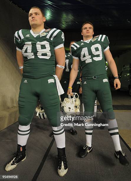 Jeremy LaVoie and Matt Weller of the Ohio Bobcats stand and wait for team introductions before the game against the Marshall University Thundering...