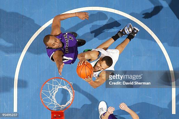 Ryan Hollins of the Minnesota Timberwolves goes to the basket against Kenny Thomas of the Sacramento Kings during the game on December 18, 2009 at...