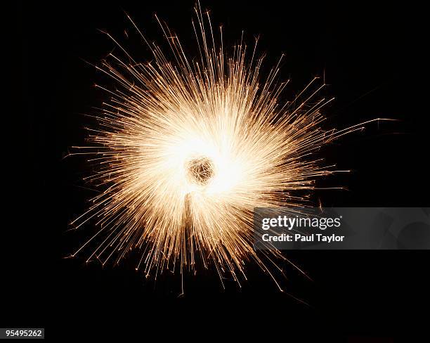 burst of sparks - sparks stock pictures, royalty-free photos & images