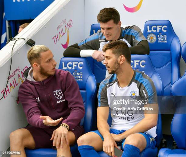 Marko Arnautovic of West Ham United chats with Aleksandar Dragovic of Leicester City prior to the Premier League match between Leicester City and...