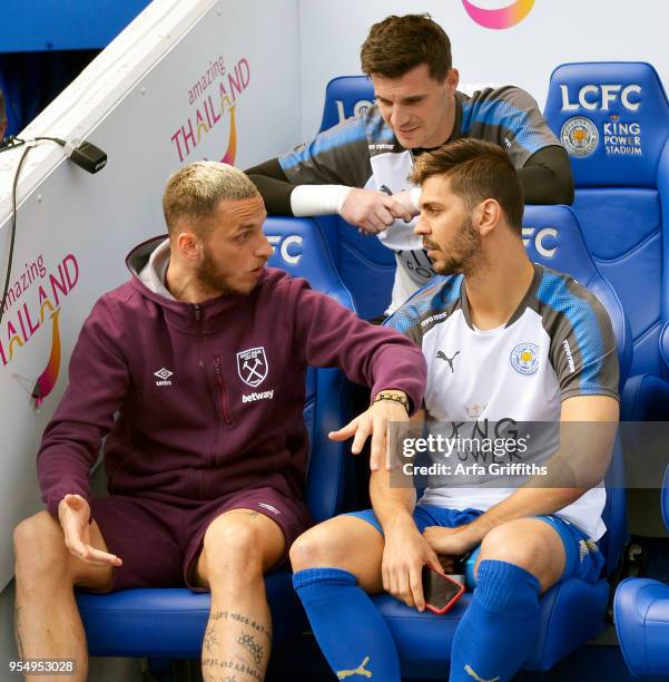 Marko Arnautovic of West Ham United chats with Aleksandar Dragovic of Leicester City prior to the Premier League match between Leicester City and...