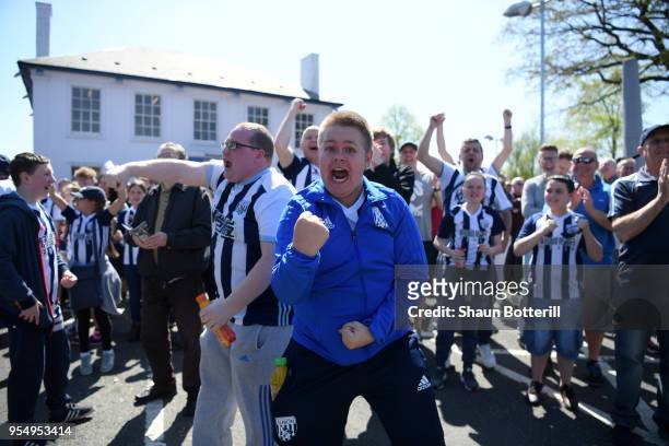 West Bromwich Albion fans react as they watch the Stoke City and Crystal Palace game prior to the Premier League match between West Bromwich Albion...