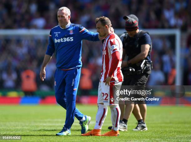 Paul Lambert, Manager of Stoke City embraces Xherdan Shaqiri of Stoke City at the full time whistle during the Premier League match between Stoke...