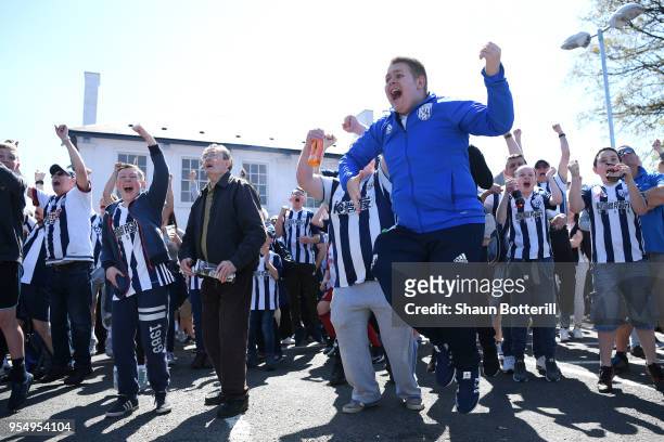 West Bromwich Albion fans react as they watch the Stoke City and Crystal Palace game prior to the Premier League match between West Bromwich Albion...
