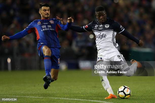 Leroy George of Melbourne Victory contests Mario Shabow of the Jets during the 2018 A-League Grand Final match between the Newcastle Jets and the...