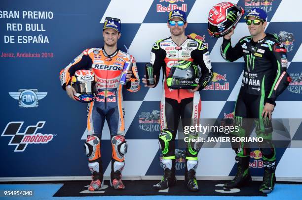 Third, first and second placed competitors, Monster Yamaha Tech 3's French rider Johann Zarco, LCR Honda's British rider Cal Crutchlow and Repsol...