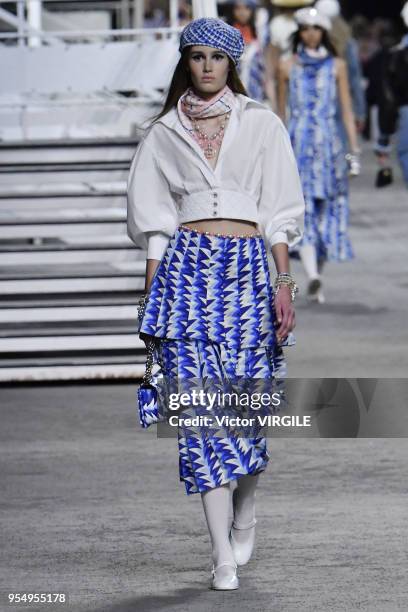 Model walks the runway during Chanel Cruise 2018/2019 Collection fashion show at Le Grand Palais on May 3, 2018 in Paris, France.