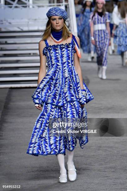 Model walks the runway during Chanel Cruise 2018/2019 Collection fashion show at Le Grand Palais on May 3, 2018 in Paris, France.