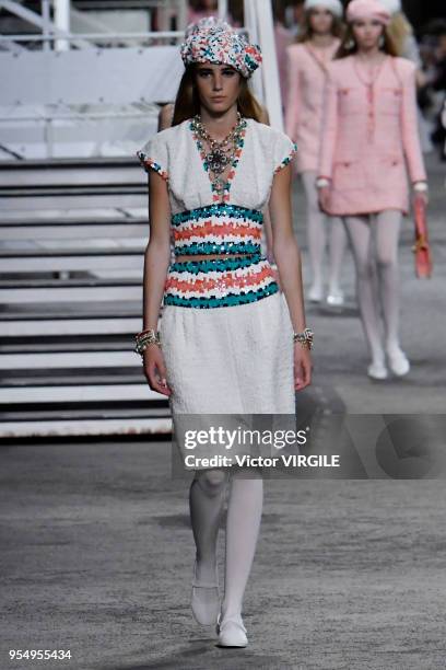 Model walks the runway during Chanel Cruise 2018/2019 Collection fashion show at Le Grand Palais on May 3, 2018 in Paris, France.