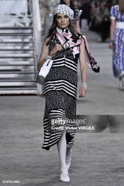Model walks the runway during Chanel Cruise 2018/2019 Collection fashion show at Le Grand Palais on May 3, 2018 in Paris, France.