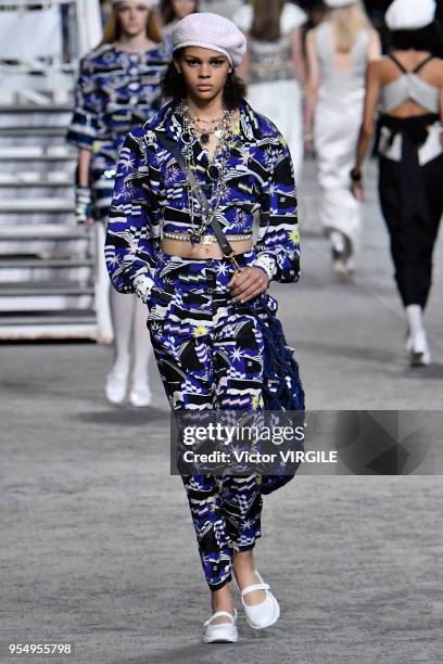 Model walks the runway during Chanel Cruise 2018/2019 Collection fashion show at Le Grand Palais on May 3, 2018 in Paris, France.