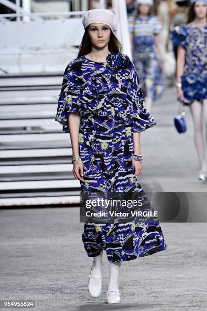 Model walks the runway during Chanel Cruise 2018/2019 Collection fashion show at Le Grand Palais on May 3, 2018 in Paris, France.