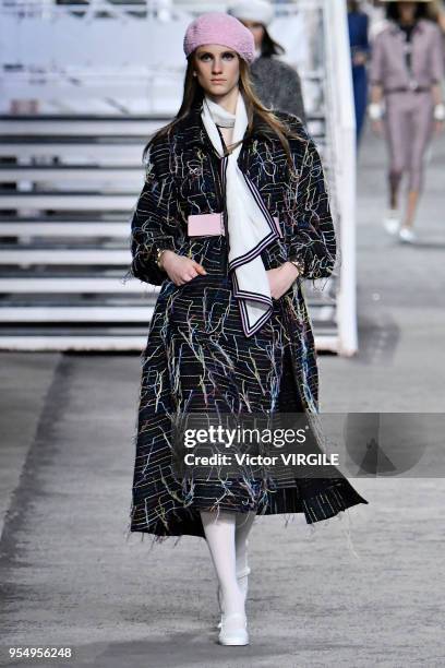 Model walks the runway during Chanel Cruise 2018/2019 Collection fashion show at Le Grand Palais on May 3, 2018 in Paris, France.