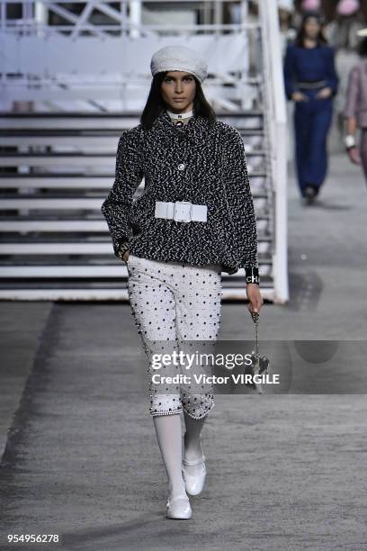 Model walks the runway during Chanel Cruise 2018/2019 Collection fashion show at Le Grand Palais on May 3, 2018 in Paris, France.