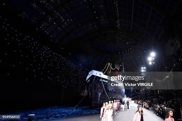 Model walks the runway during Chanel Cruise 2018/2019 Collection fashion show at Le Grand Palais on May 3, 2018 in Paris, France.