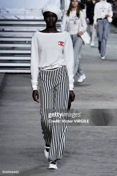 Model walks the runway during Chanel Cruise 2018/2019 Collection fashion show at Le Grand Palais on May 3, 2018 in Paris, France.