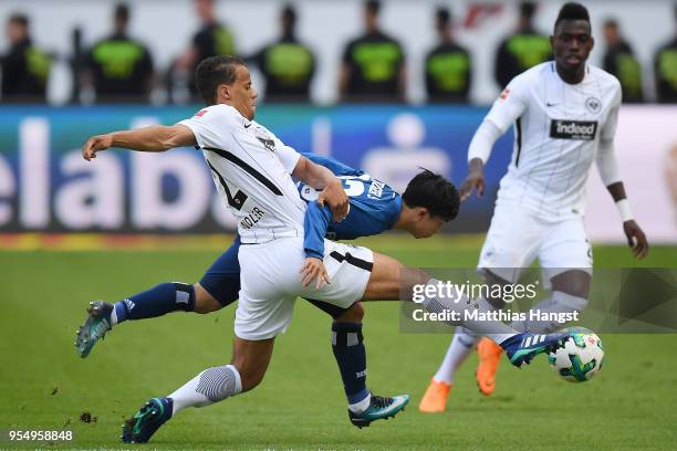 Timothy Chandler of Frankfurt fights for the ball with Tatsuya Ito of Hamburg during the Bundesliga match between Eintracht Frankfurt and Hamburger...