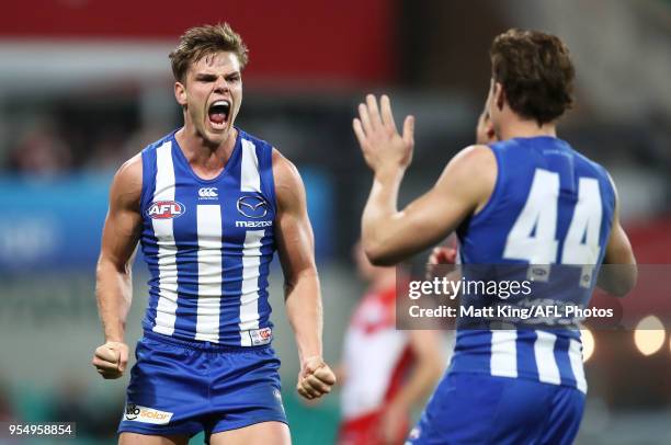 Mason Wood of the Kangaroos celebrates kicking the final goal during the round seven AFL match between the Sydney Swans and the North Melbourne...