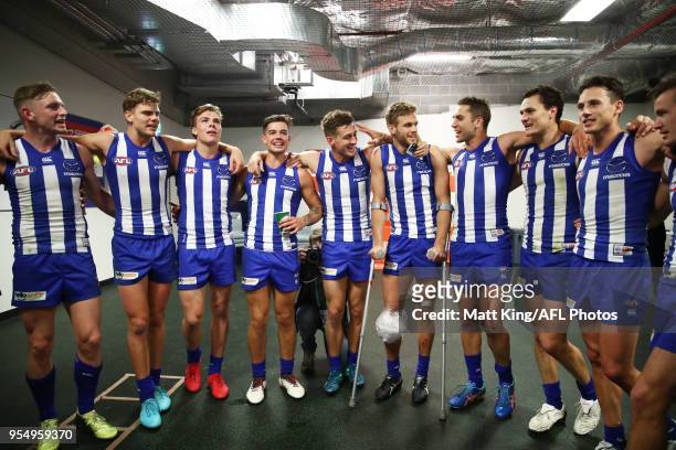 The Kangaroos celebrate victory and sing the club song after the round seven AFL match between the Sydney Swans and the North Melbourne Kangaroos at...