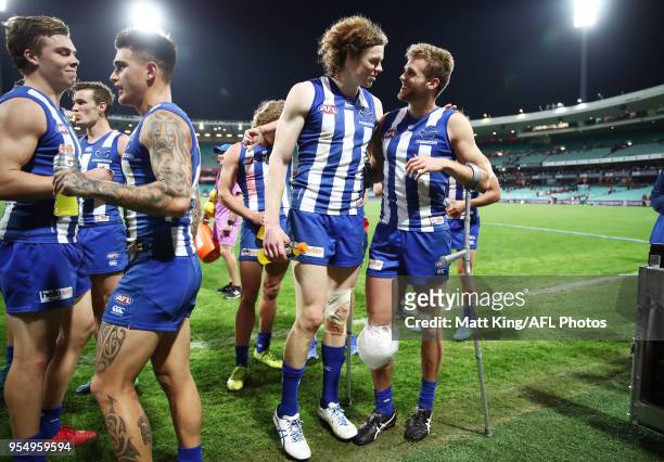 Ben Brown and Ed Vickers-Willis of the Kangaroos celebrate victory after the round seven AFL match between the Sydney Swans and the North Melbourne...