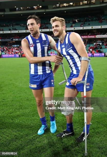 Sam Wright and Ed Vickers-Willis of the Kangaroos celebrate victory after the round seven AFL match between the Sydney Swans and the North Melbourne...