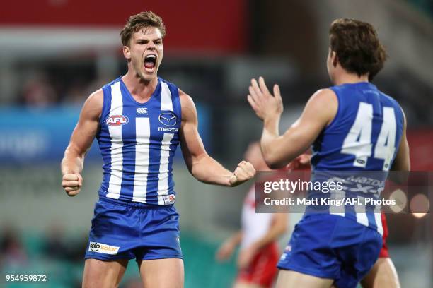 Mason Wood of the Kangaroos celebrates kicking the final goal during the round seven AFL match between the Sydney Swans and the North Melbourne...