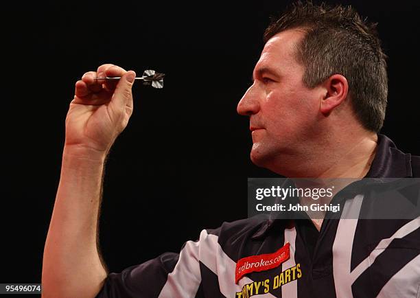 Ronnie Baxter of England in action against Colin Lloyd of England during the 2010 Ladbrokes.com World Darts Championships at Alexandra Palace on...