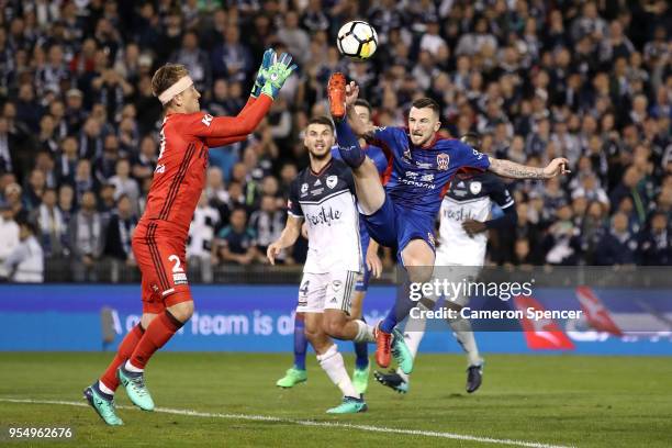 Roy O'Donovan of the Jets collides with Lawrence Thomas of the Victory during the 2018 A-League Grand Final match between the Newcastle Jets and the...